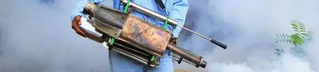 Fumigation technician using a fogger for deep pest treatment in Lincoln, NE